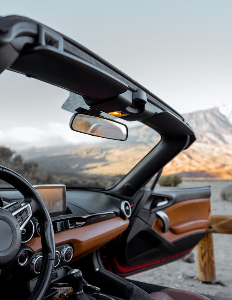 Convertiblle sports car on the mountain roadside 2021 09 02 01 35 55 utc.jpg