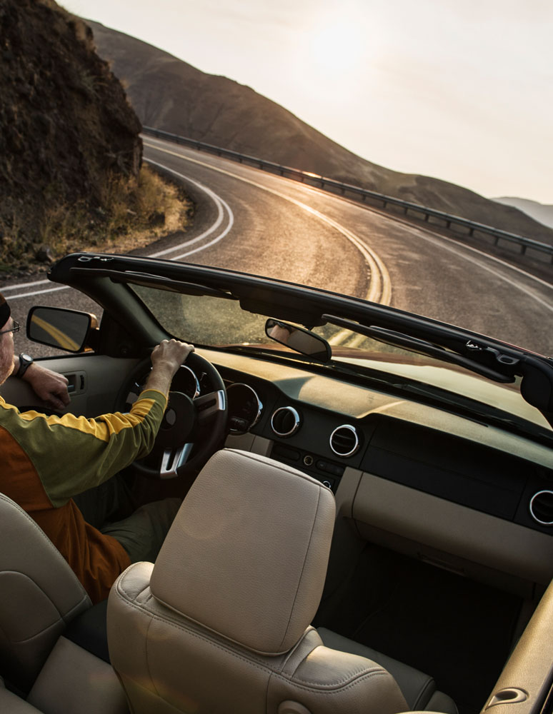 Male driver in a convertible sports car driving on 2021 08 29 09 05 55 utc.jpg